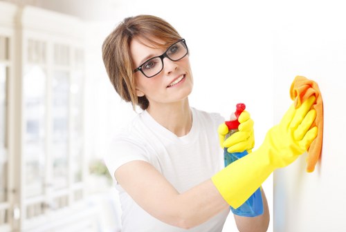 Local technician assessing a stain on a carpet in a Roehampton property