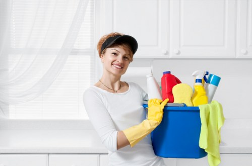 Professional cleaning of desks and workspaces in a Roehampton office
